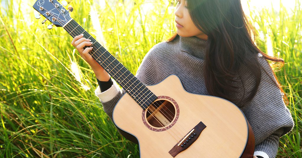 Girl holding a guitar