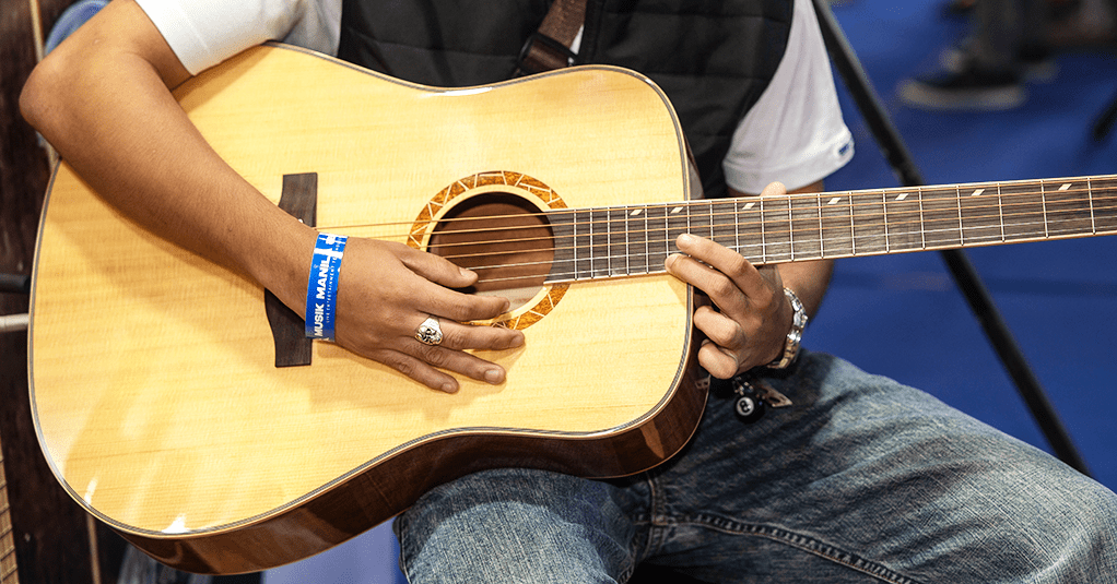 Men holding a guitar