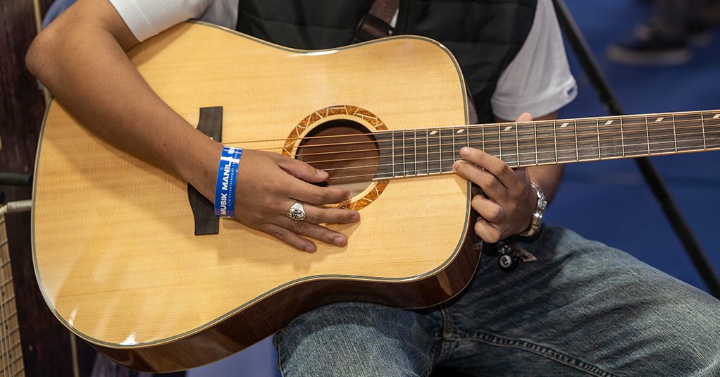 Men holding a guitar