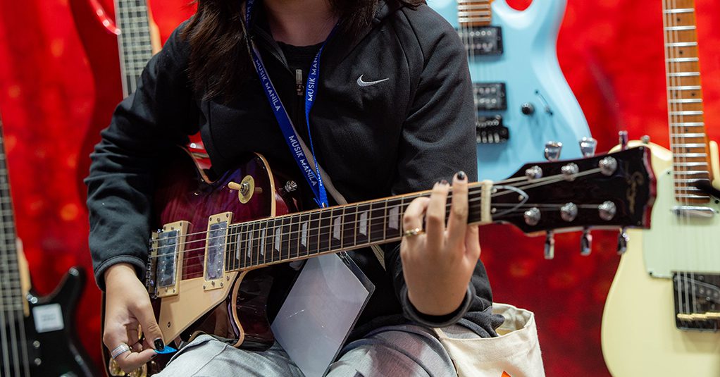 Girl playing Smiger Guitar