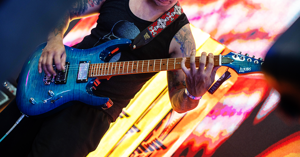 Men Playing Electronic Guitar
